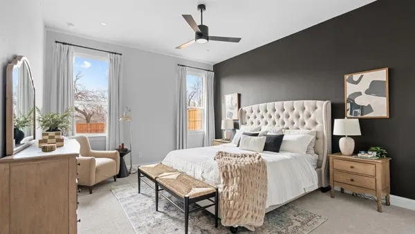 a bedroom with a bed and a couch