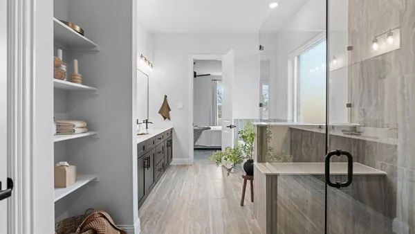 a view of entryway and hall with a bathtub