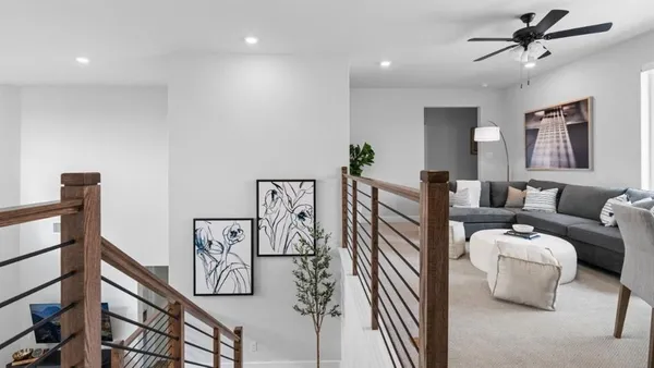 a living room with furniture and white walls