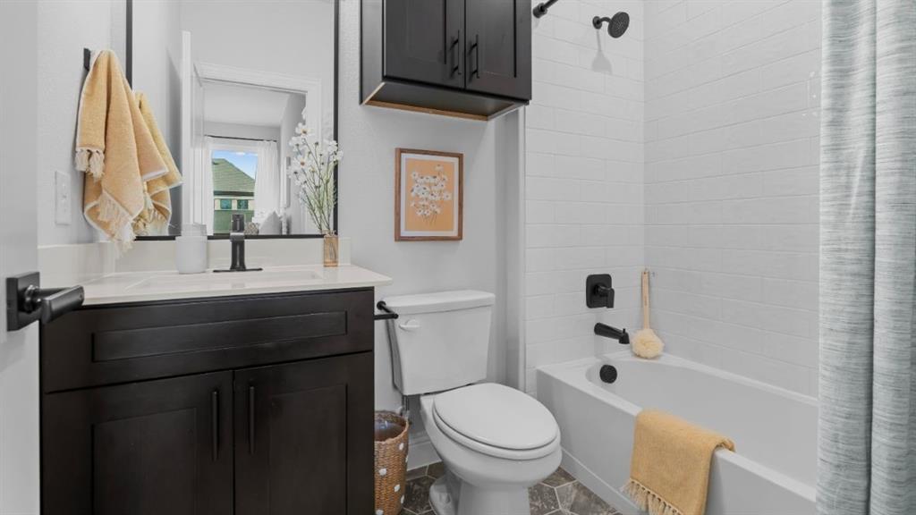 1633 Keneipp Road Carrollton, TX 75006 - Photo 17 of 18 a bathroom with a sink and a mirror