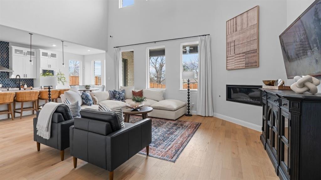 1633 Keneipp Road Carrollton, TX 75006 - Photo 10 of 18 a living room with furniture and a flat screen tv