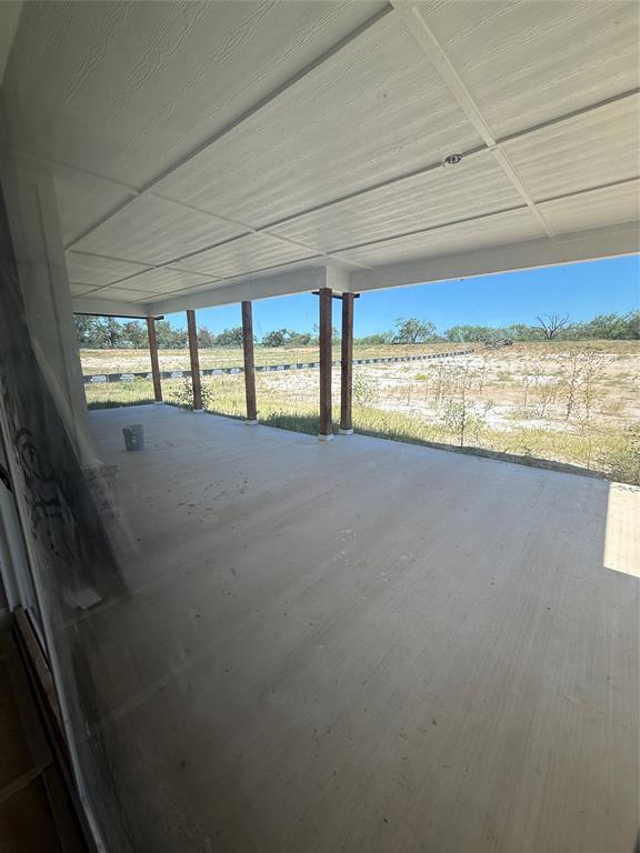 317 Jonny Boy Way Springtown, TX 76082 - Photo 28 of 34 Looking out of double glass sliders to back porch