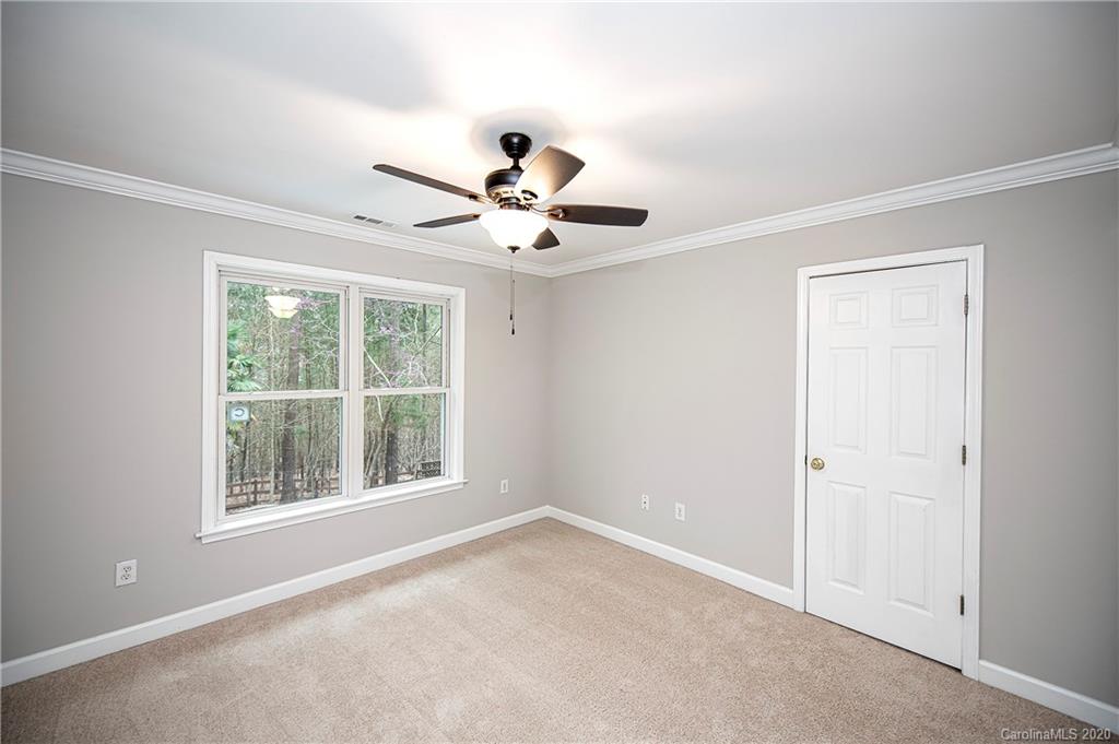 11135 Scullers Run Tega Cay, SC 29708 - Photo 20 of 33 an empty room with a window and a fan