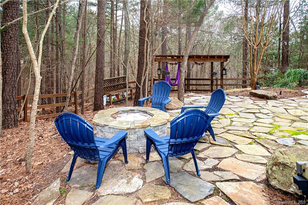 11135 Scullers Run Tega Cay, SC 29708 - Photo 30 of 33 a view of balcony with wooden floor and outdoor seating