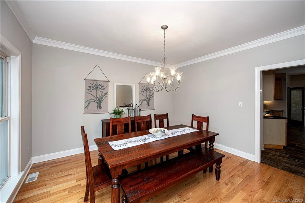 11135 Scullers Run Tega Cay, SC 29708 - Photo 6 of 33 a living room with furniture and a chandelier