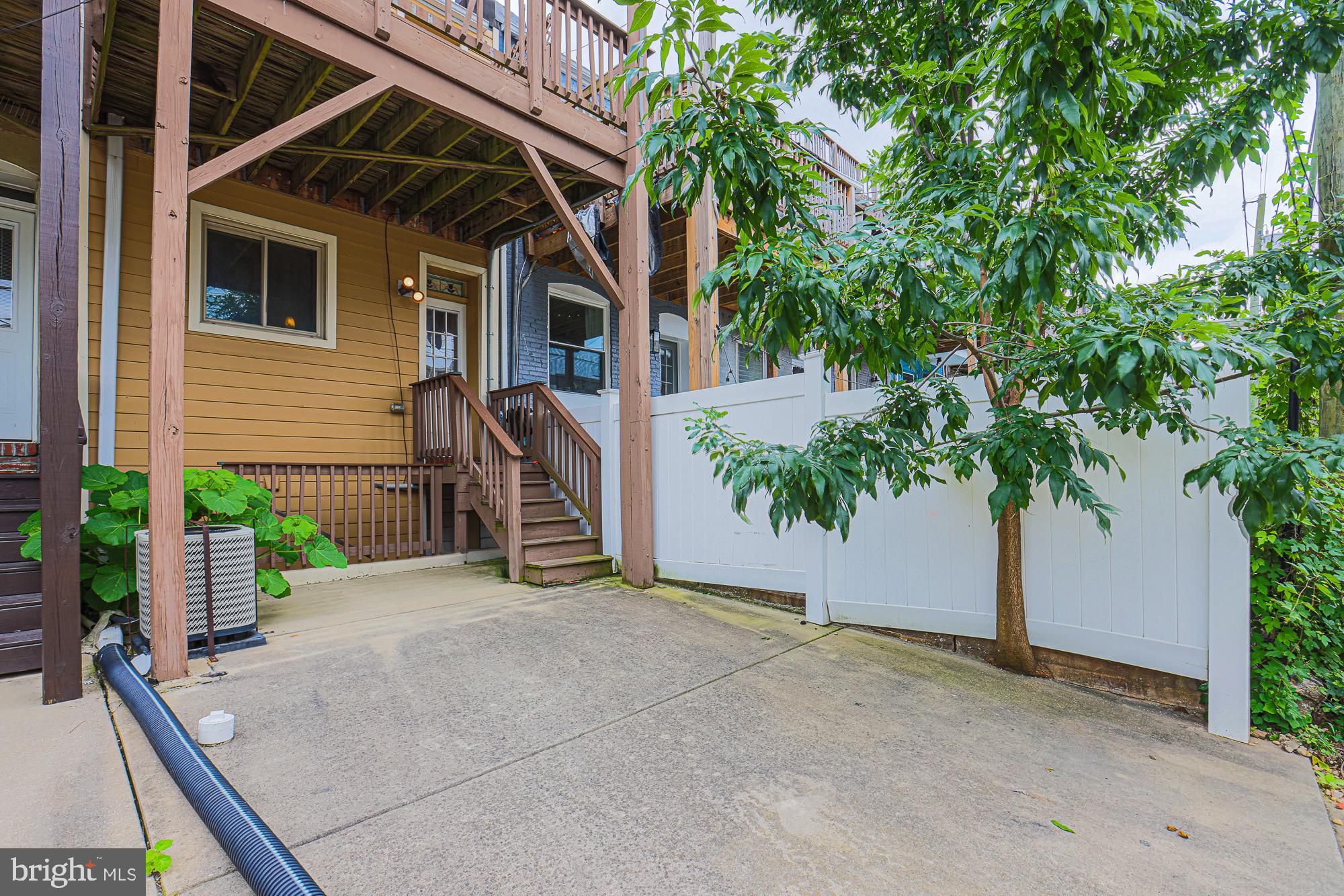 122 South Potomac Street Baltimore, MD 21224 - Photo 12 of 31 a view of a house with a tree
