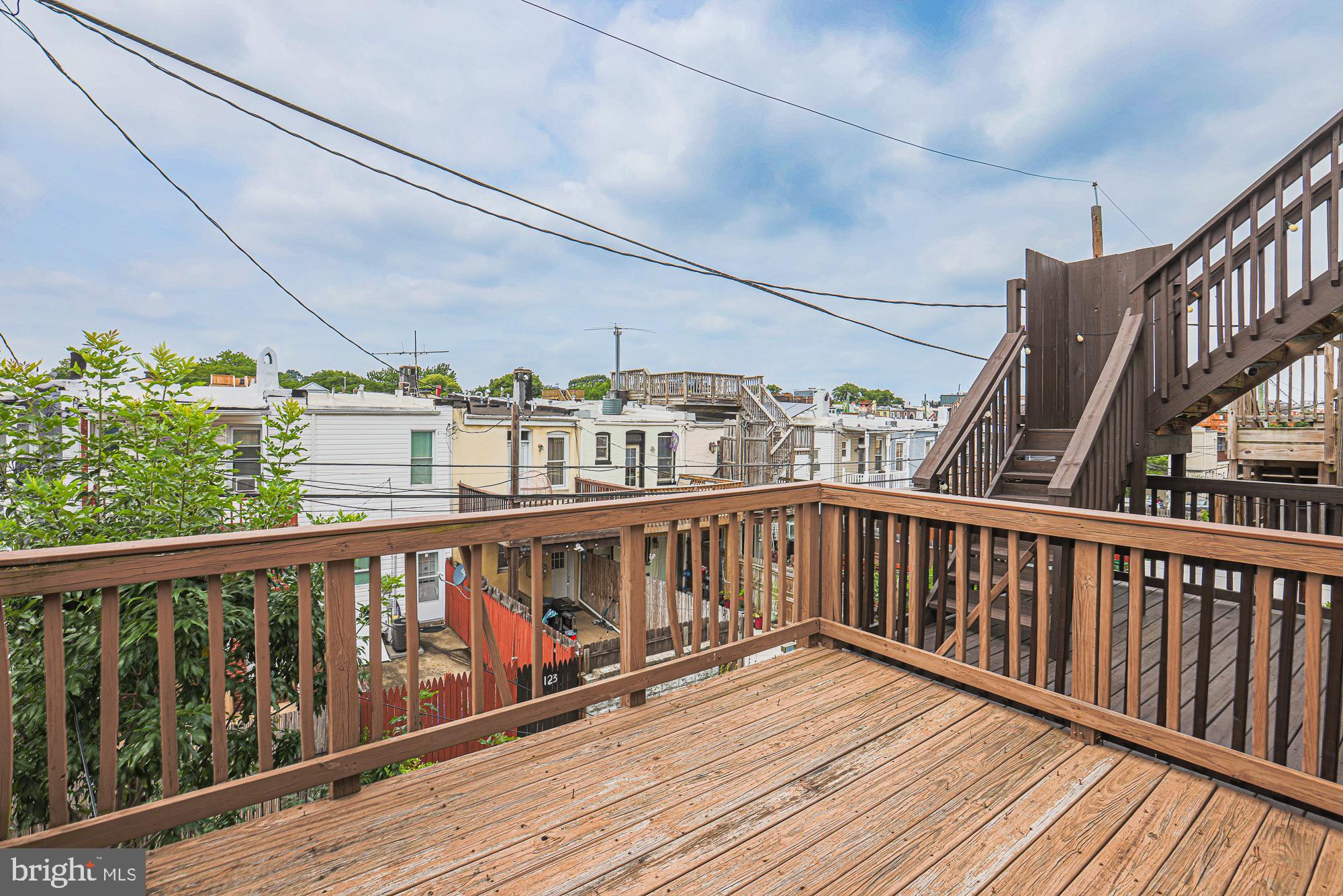 122 South Potomac Street Baltimore, MD 21224 - Photo 16 of 31 a view of balcony with wooden floor