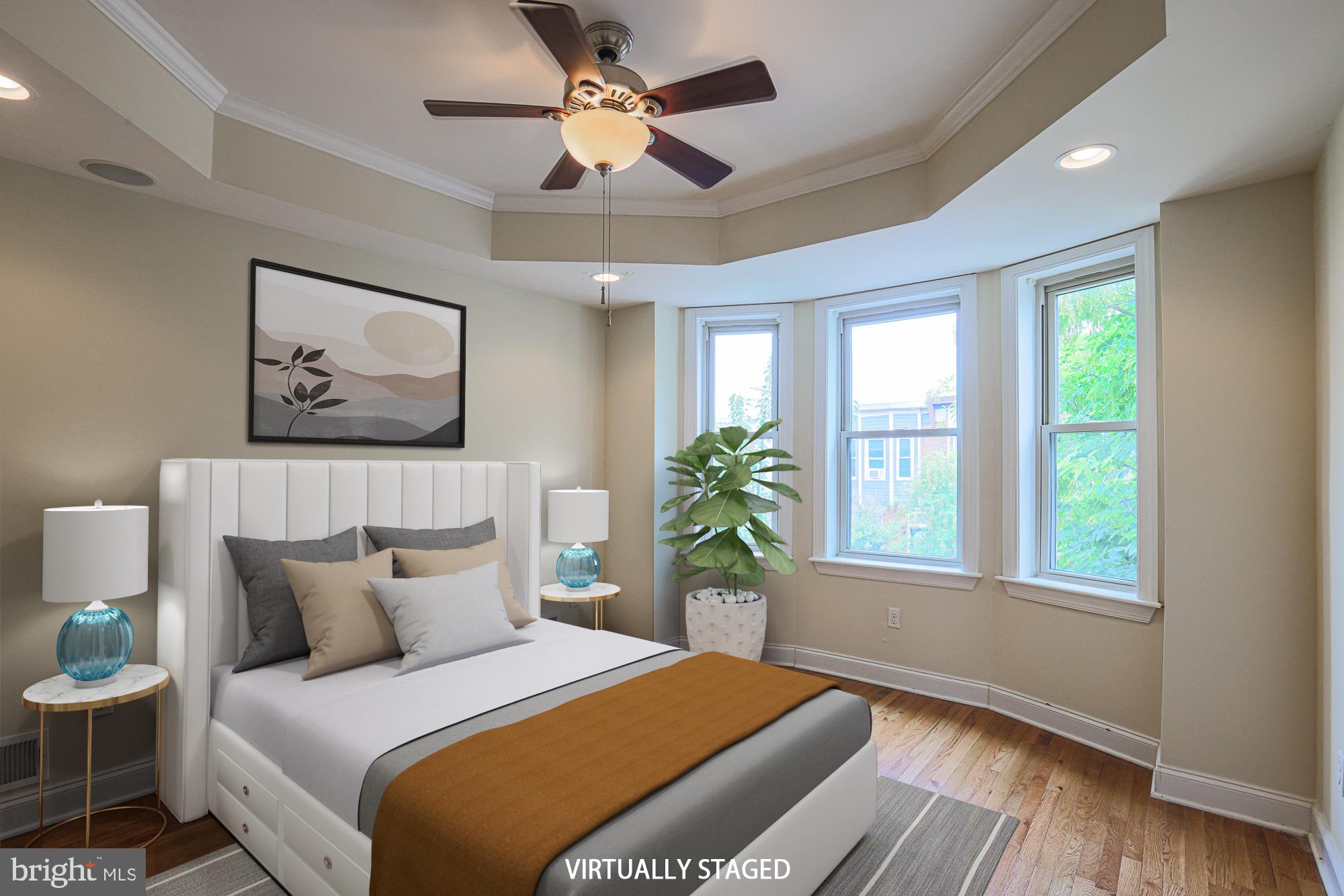 122 South Potomac Street Baltimore, MD 21224 - Photo 22 of 31 a bedroom with a large bed and a window