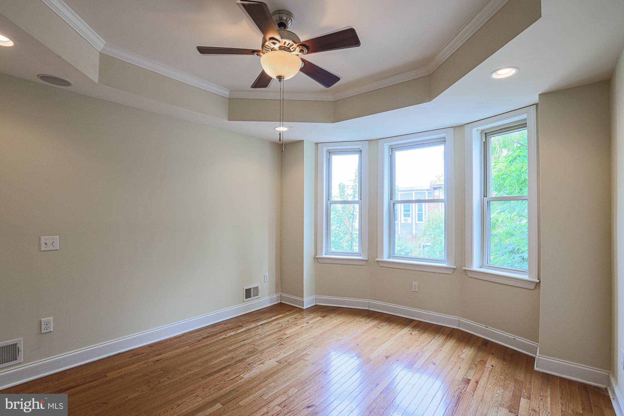 122 South Potomac Street Baltimore, MD 21224 - Photo 23 of 31 wooden floor in an empty room with a window