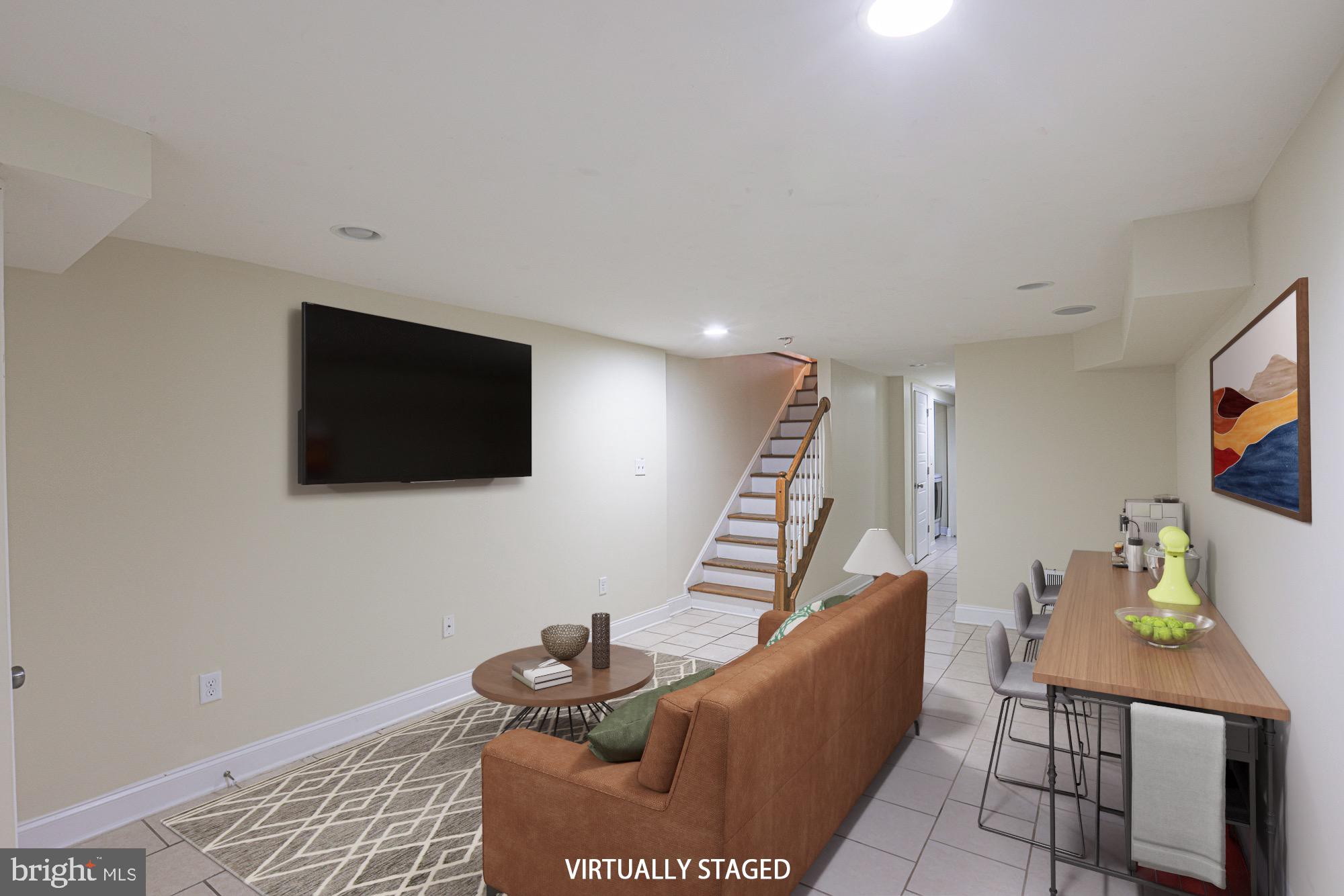 122 South Potomac Street Baltimore, MD 21224 - Photo 27 of 31 a living room with furniture and a flat screen tv