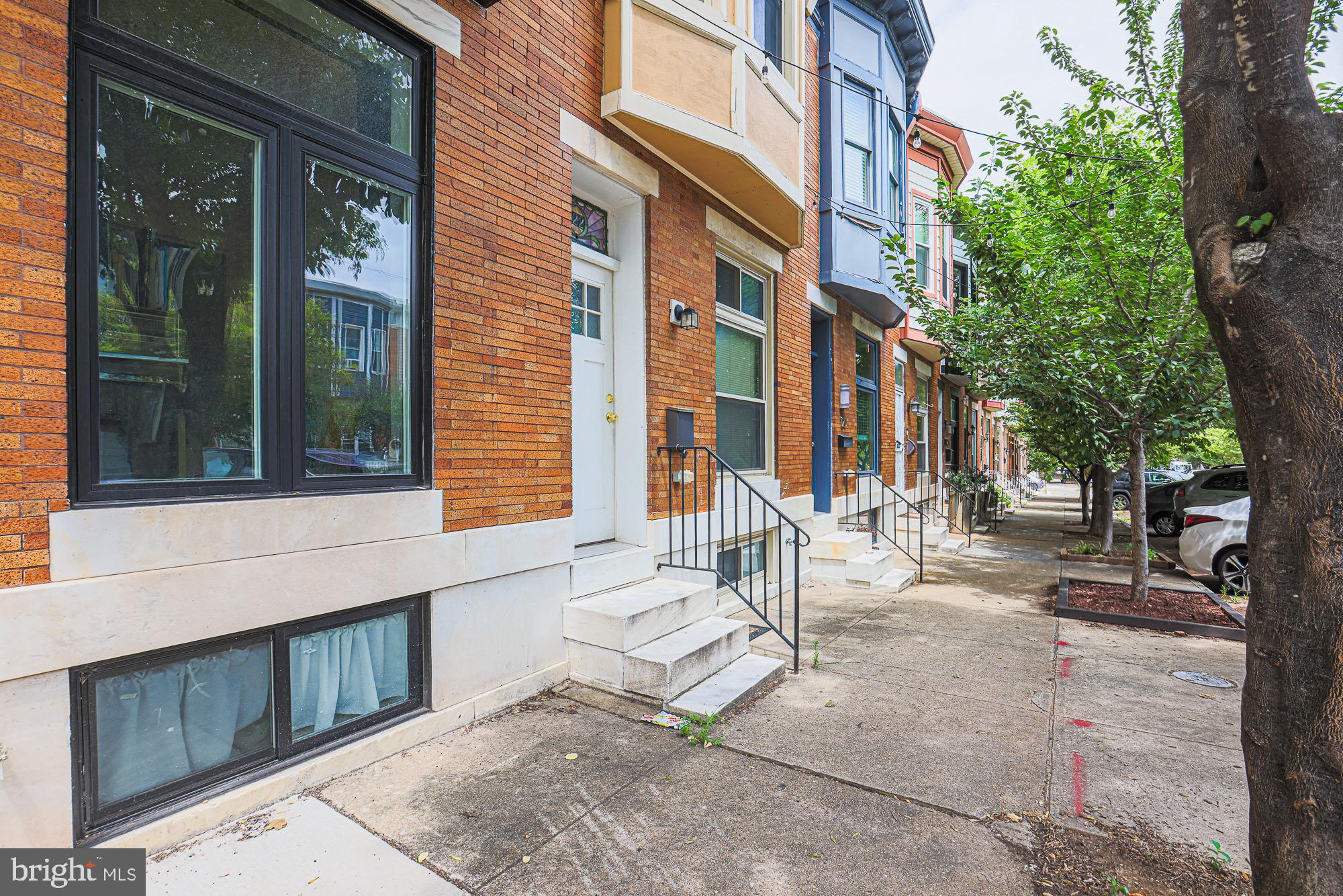 122 South Potomac Street Baltimore, MD 21224 - Photo 3 of 31 a view of a building with a bench