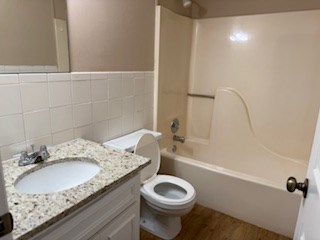 5201 Vincent Drive Columbus, GA 31907 - Photo 11 of 18 a bathroom with a granite countertop sink toilet and shower