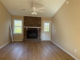 5201 Vincent Drive Columbus, GA 31907 - Photo 8 of 18 an empty room with windows a fireplace and wooden floor
