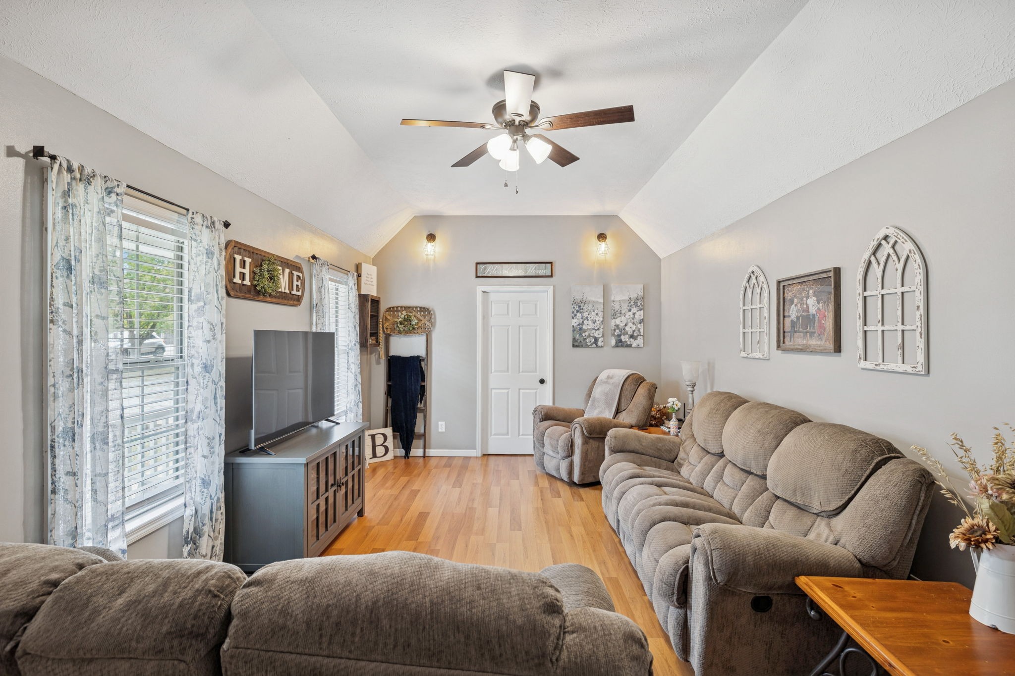 1904 Buffalo Road Hohenwald, TN 38462 - Photo 17 of 51 a living room with furniture a ceiling fan and a window