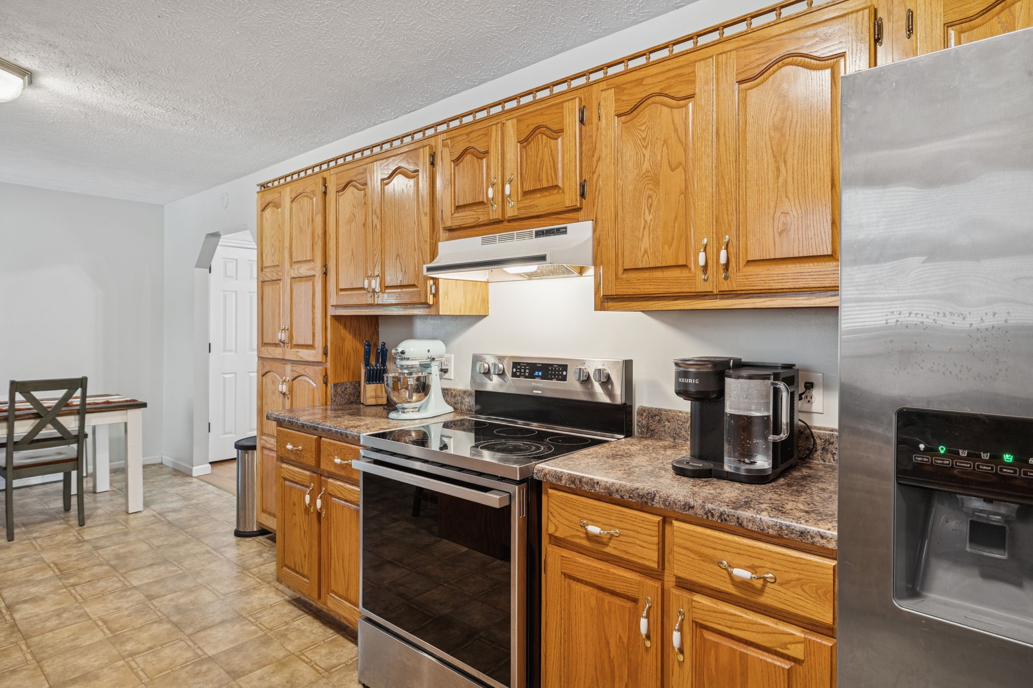 1904 Buffalo Road Hohenwald, TN 38462 - Photo 31 of 51 a kitchen with stainless steel appliances granite countertop a stove a sink and a microwave