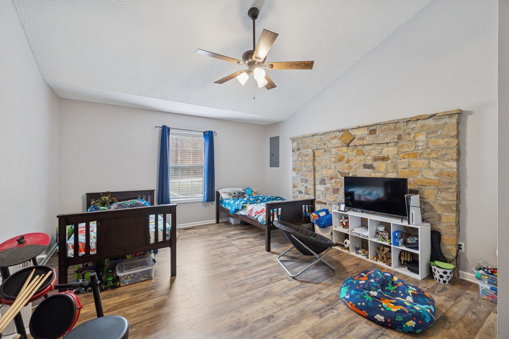 1904 Buffalo Road Hohenwald, TN 38462 - Photo 34 of 51 a living room with furniture a flat screen tv and a fireplace