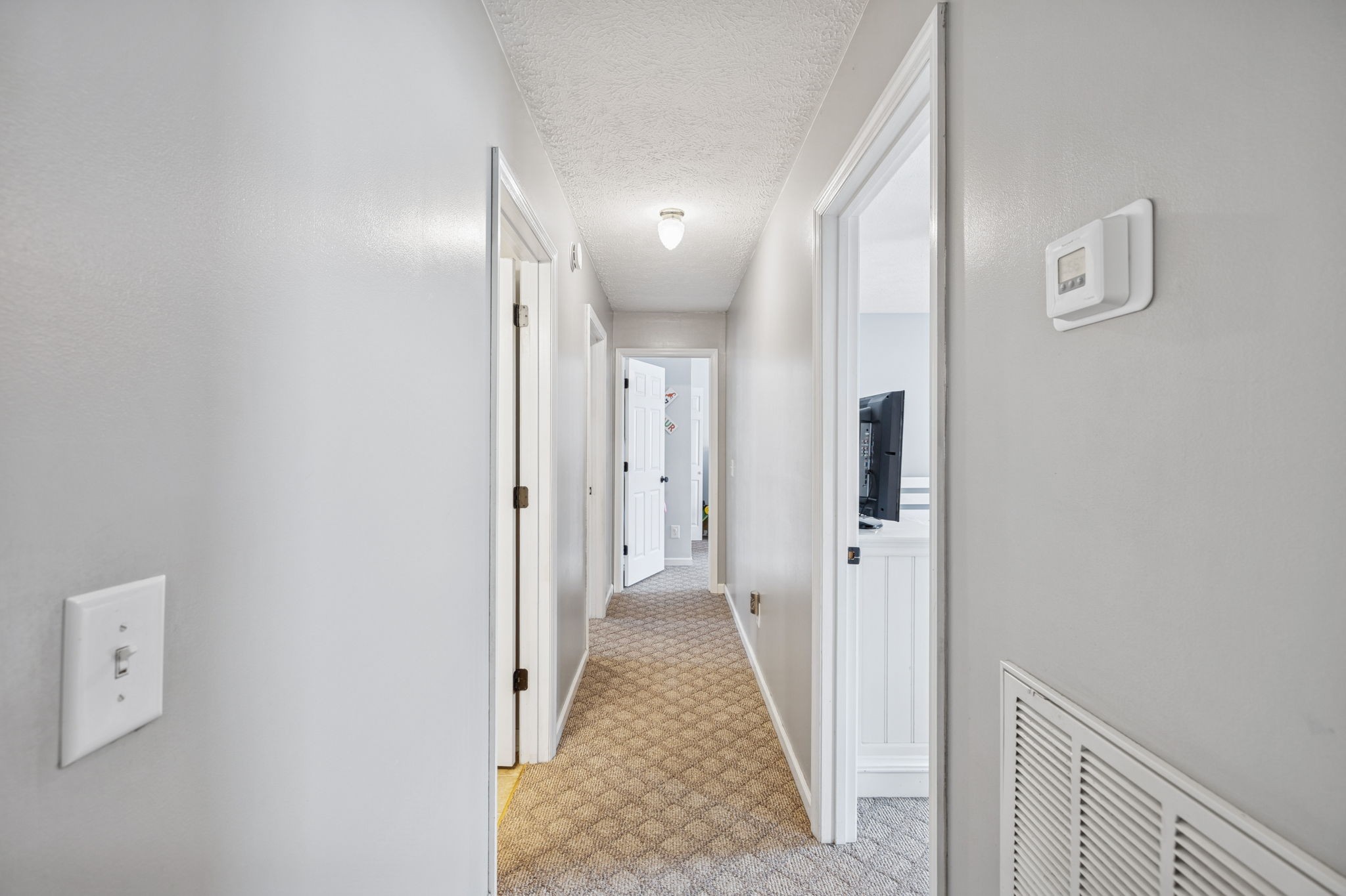 1904 Buffalo Road Hohenwald, TN 38462 - Photo 36 of 51 a view of a hallway with wooden shelves