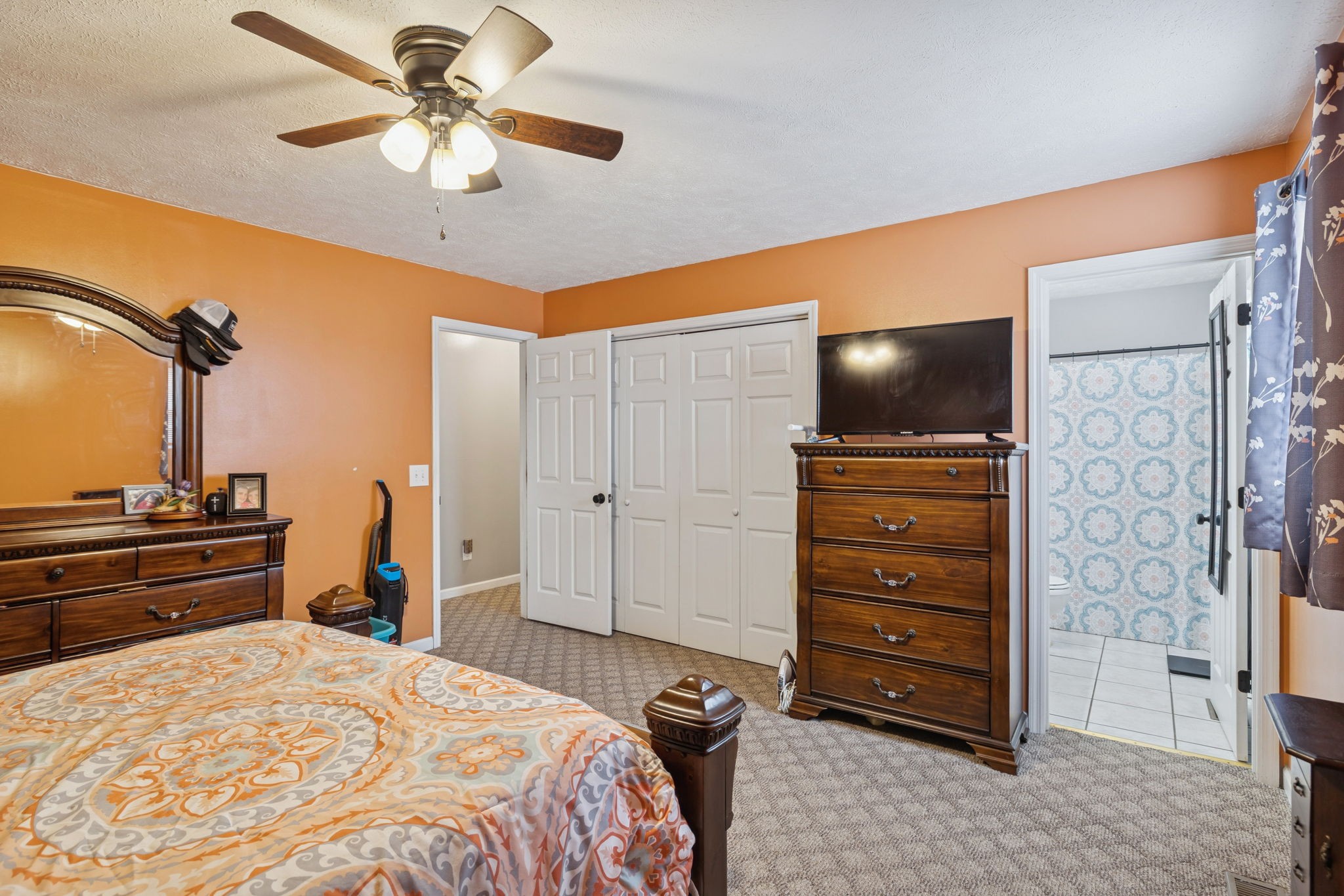 1904 Buffalo Road Hohenwald, TN 38462 - Photo 43 of 51 a bedroom with a bed and a flat tv screen on dresser