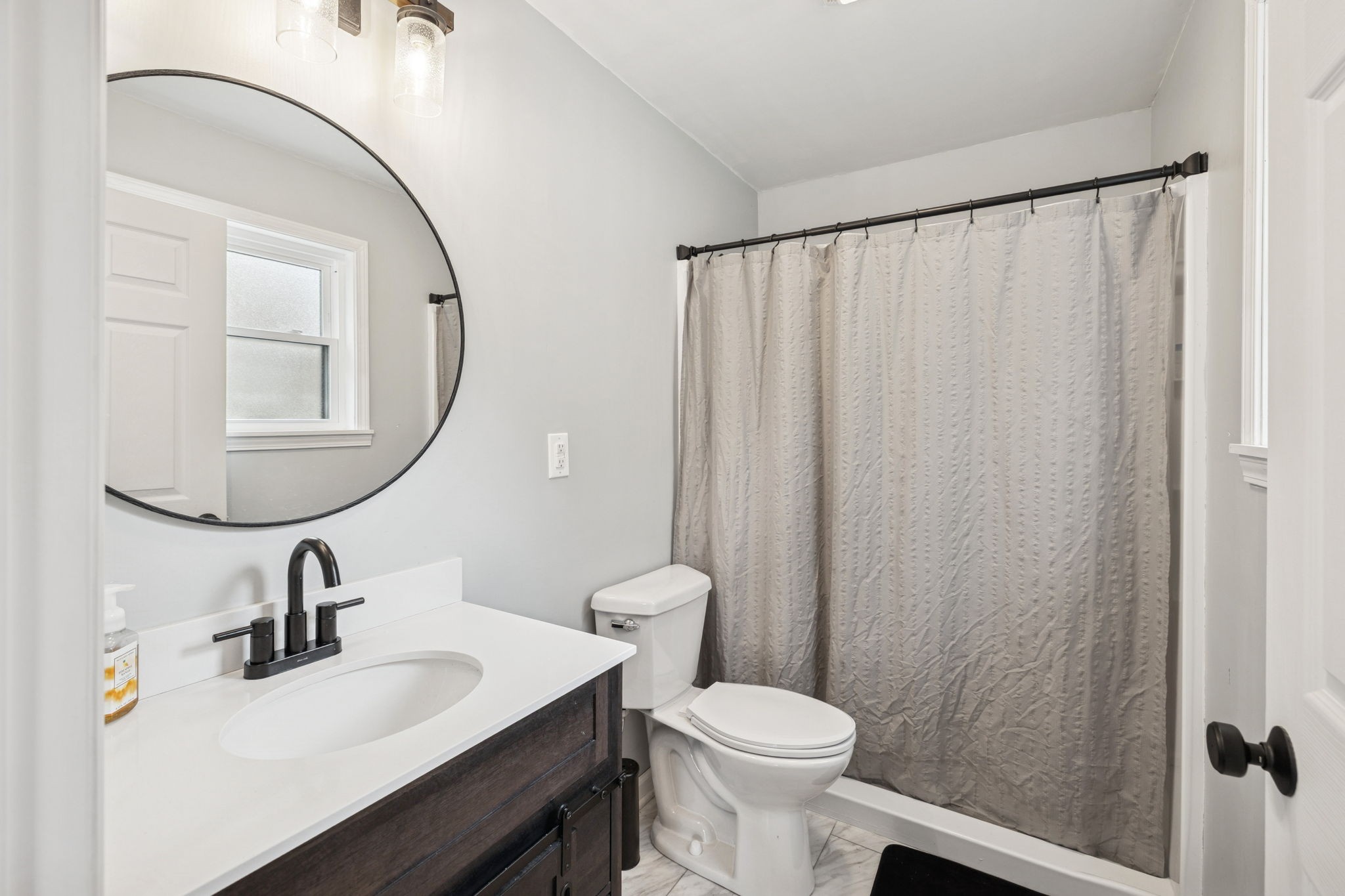 1904 Buffalo Road Hohenwald, TN 38462 - Photo 48 of 51 a bathroom with a sink a toilet and a mirror