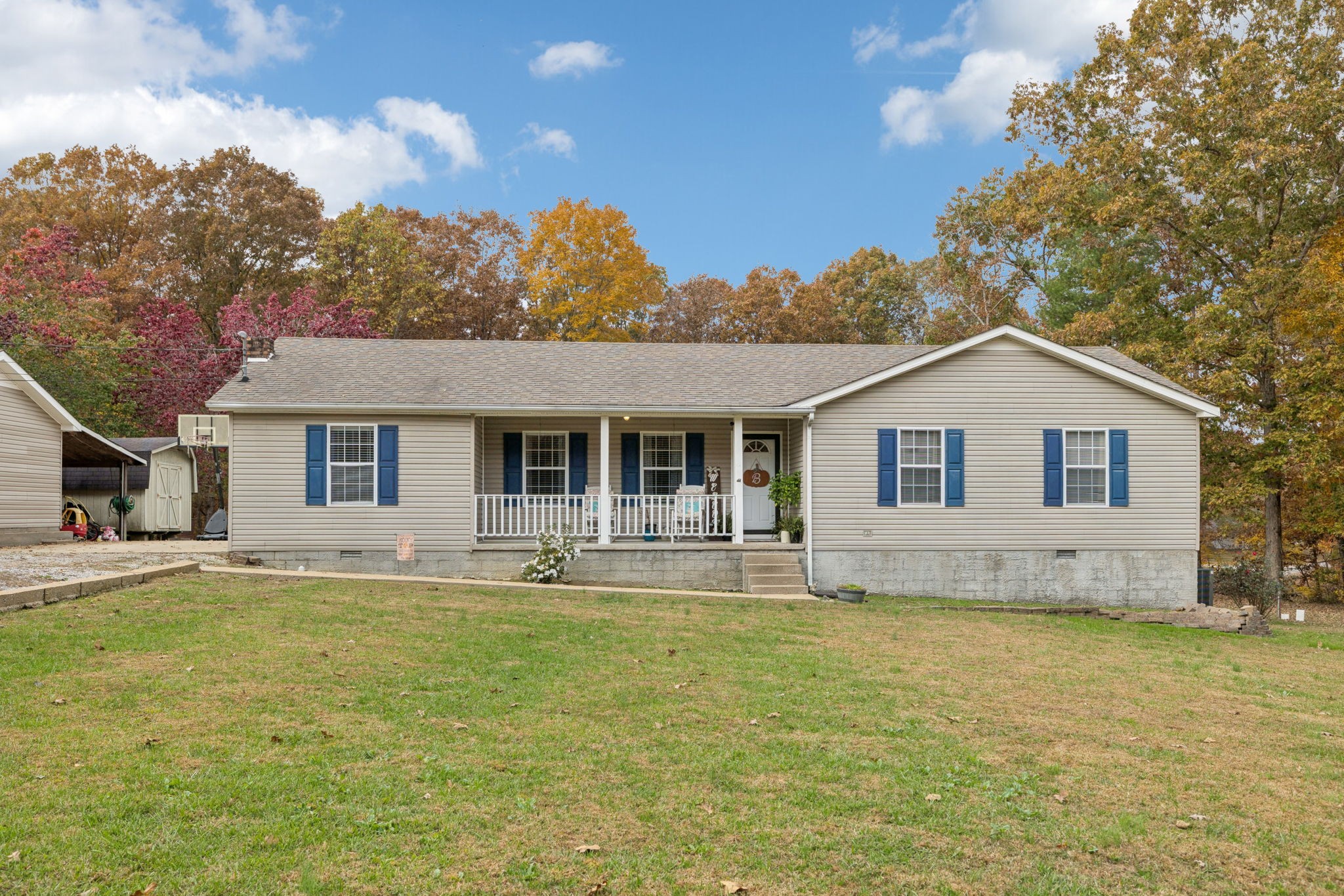 1904 Buffalo Road Hohenwald, TN 38462 - Photo 6 of 51 a front view of a house with a yard outdoor seating and garage