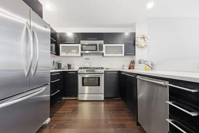 a kitchen with stainless steel appliances and a sink