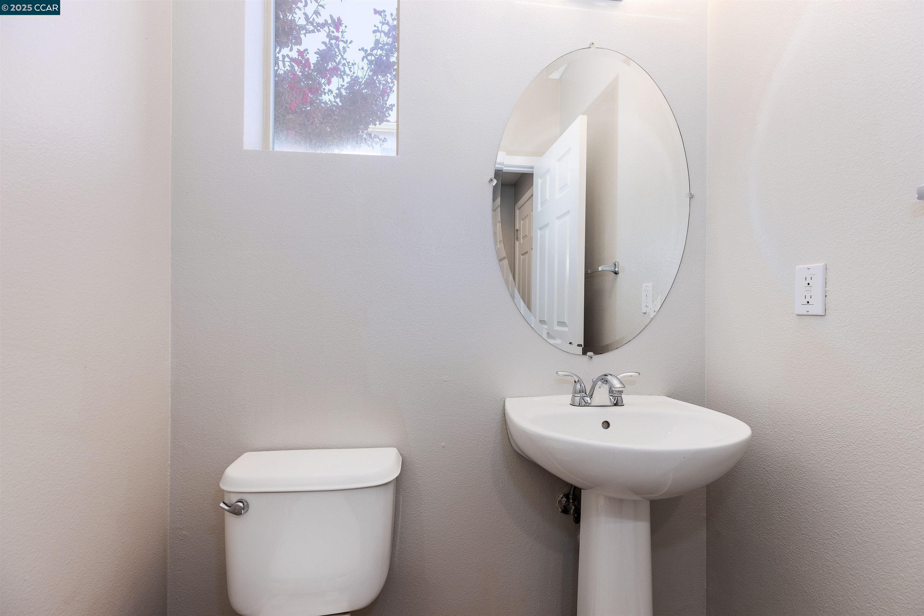 2000 Amaryllis San Ramon, CA 94583 - Photo 12 of 20 a bathroom with a toilet sink and mirror