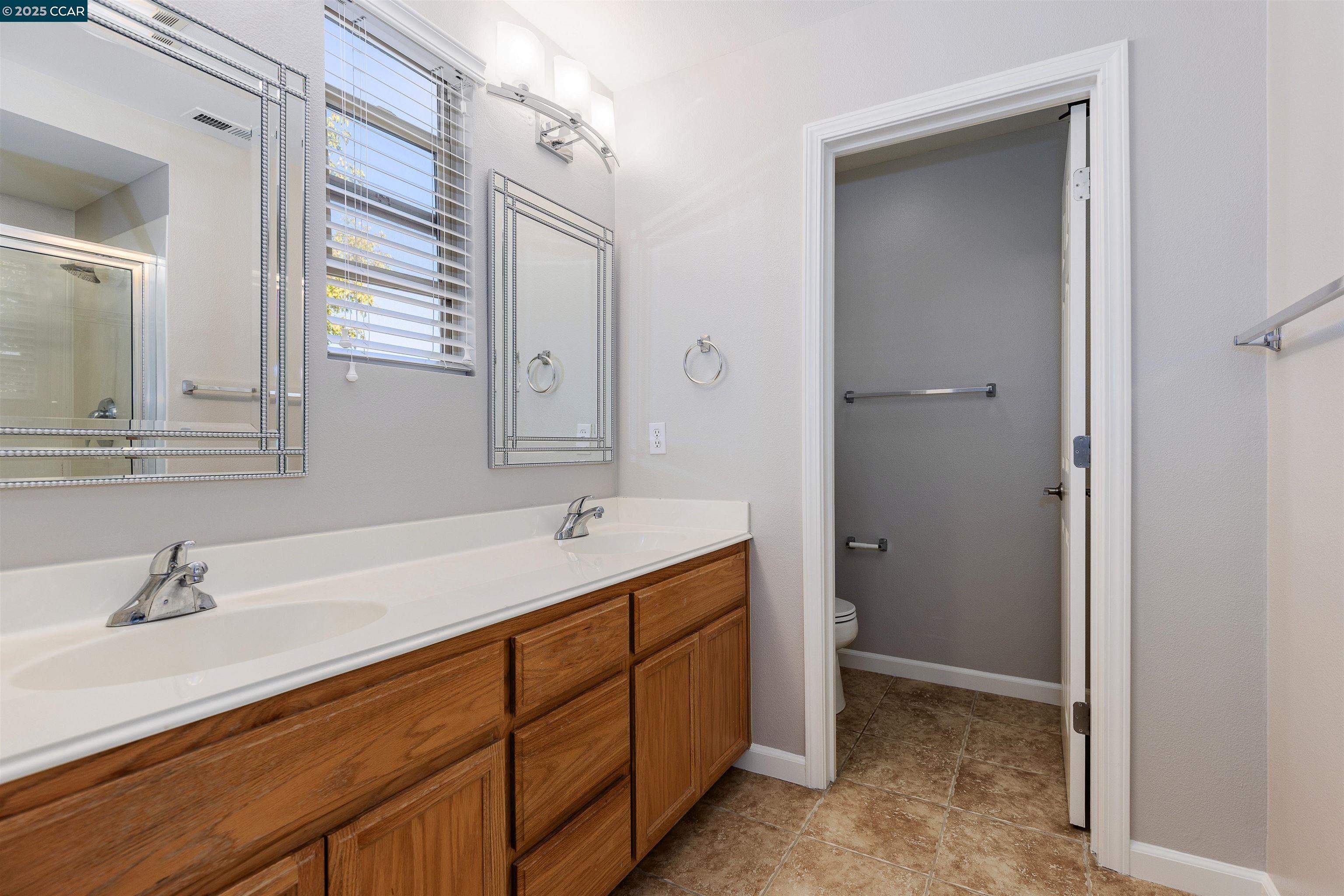 2000 Amaryllis San Ramon, CA 94583 - Photo 16 of 20 a bathroom with a sink and a mirror