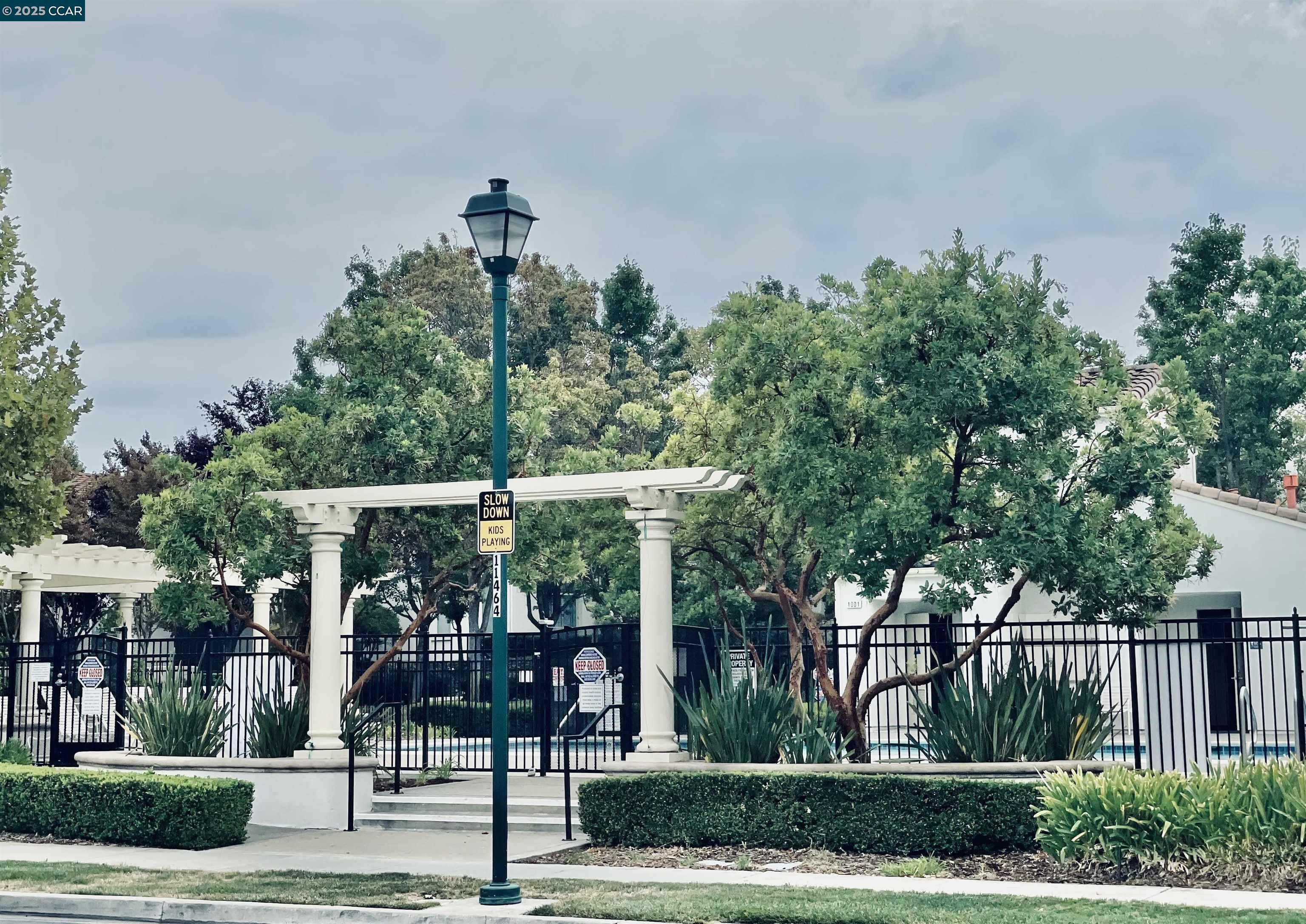 2000 Amaryllis San Ramon, CA 94583 - Photo 20 of 20 a view of a patio with table and chairs potted plants and floor to ceiling window