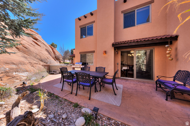 3461 Westwater Road, Unit 6 Moab, UT 84532 - Photo 25 of 33 View of patio / terrace with outdoor dining area, a grill, and a hot tub