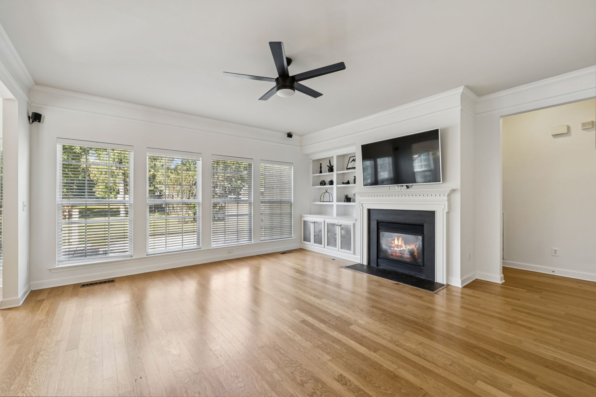 2006 Flocking Drive Spring Hill, TN 37174 - Photo 11 of 86 a view of empty room with wooden floor fireplace and a window