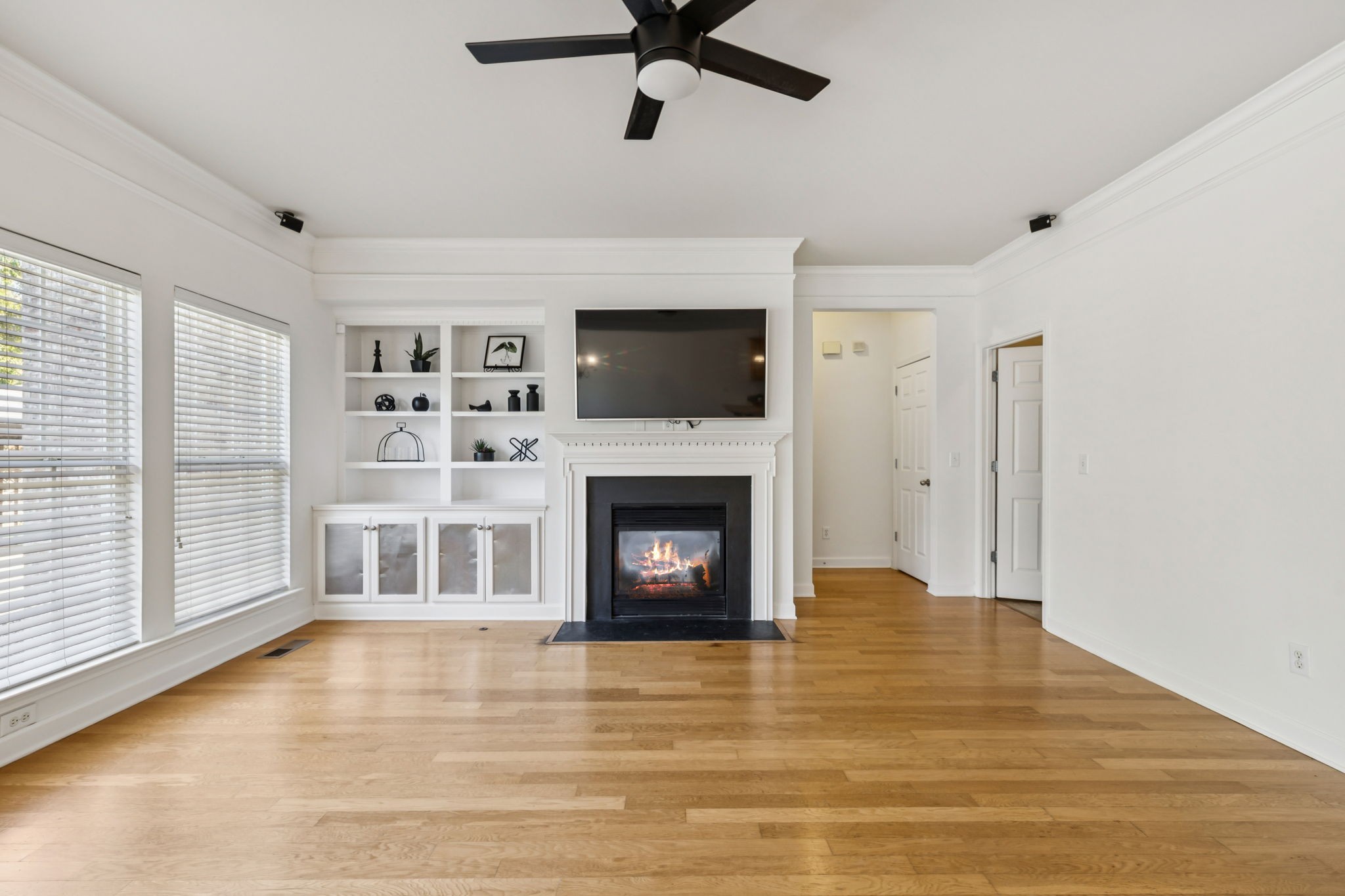 2006 Flocking Drive Spring Hill, TN 37174 - Photo 12 of 86 a living room with a fireplace and a flat screen tv