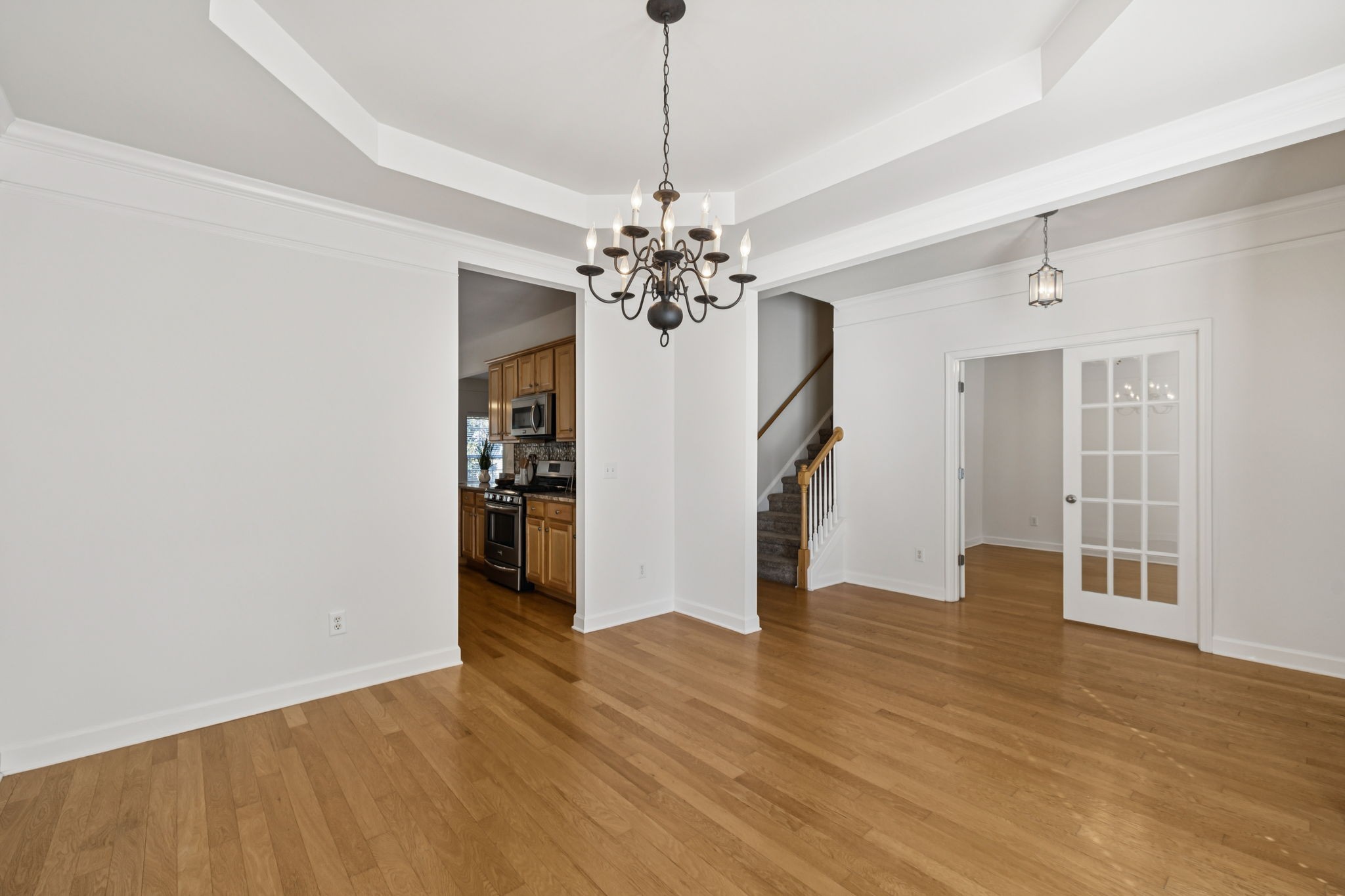 2006 Flocking Drive Spring Hill, TN 37174 - Photo 19 of 86 a view of a livingroom with wooden floor and a ceiling fan