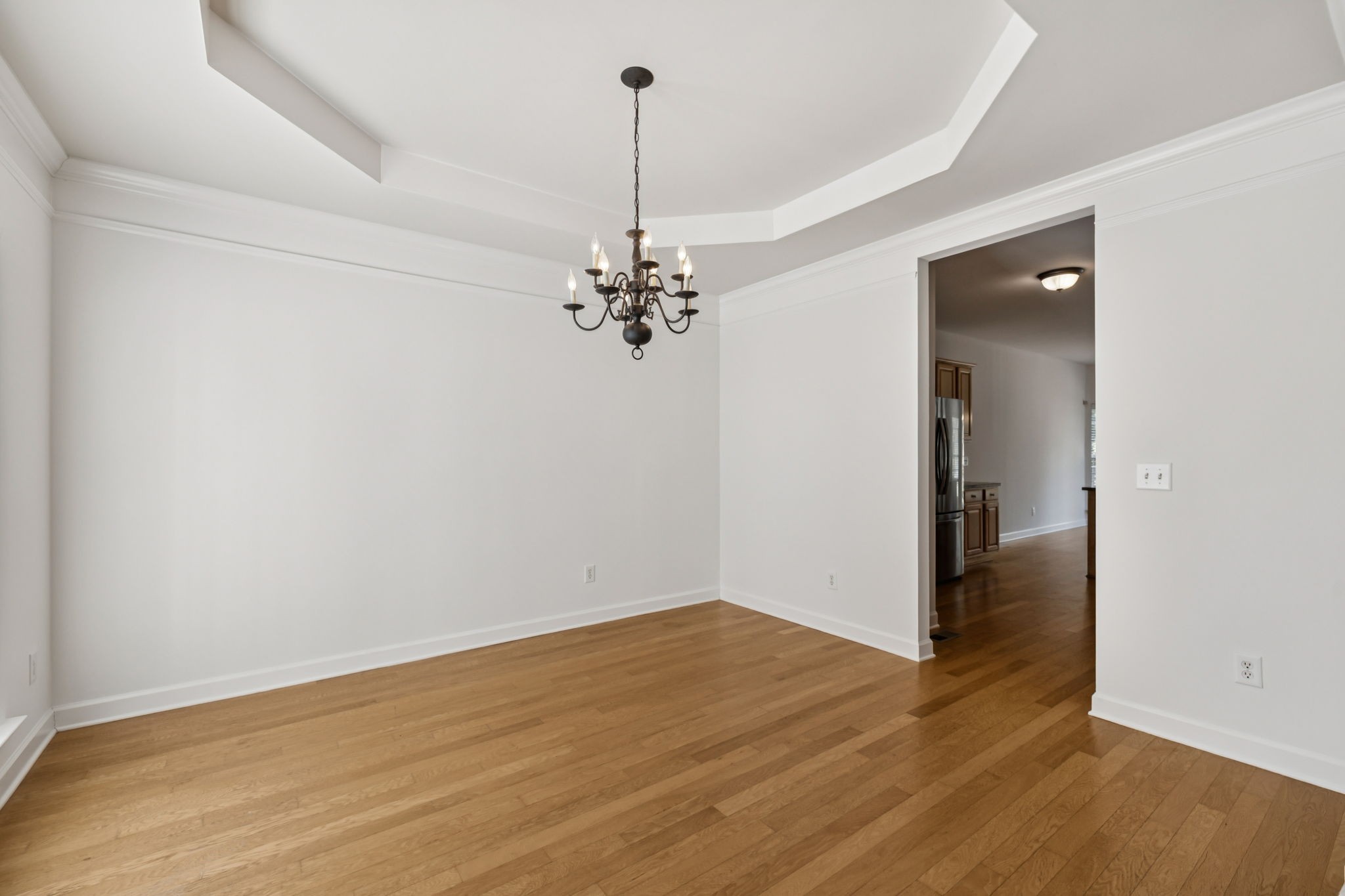2006 Flocking Drive Spring Hill, TN 37174 - Photo 20 of 86 a view of a room with wooden floor and chandelier