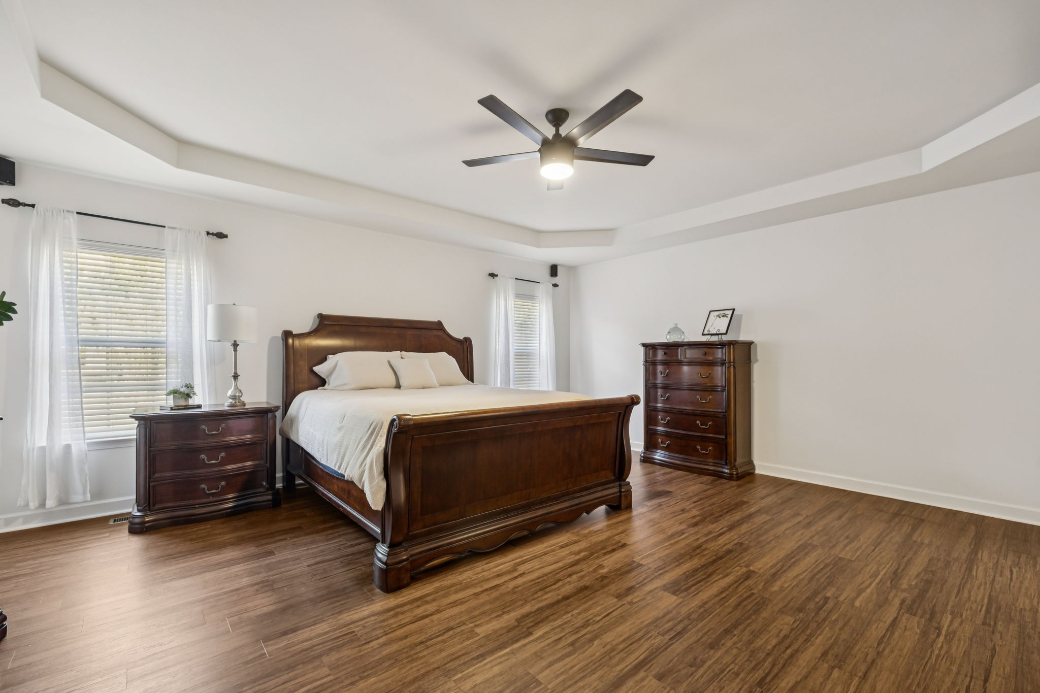 2006 Flocking Drive Spring Hill, TN 37174 - Photo 33 of 86 a bedroom with a bed and a chandelier