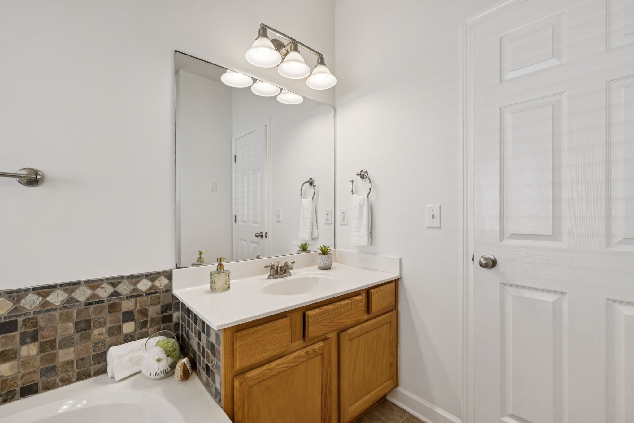 2006 Flocking Drive Spring Hill, TN 37174 - Photo 39 of 86 a bathroom with a sink vanity and a mirror