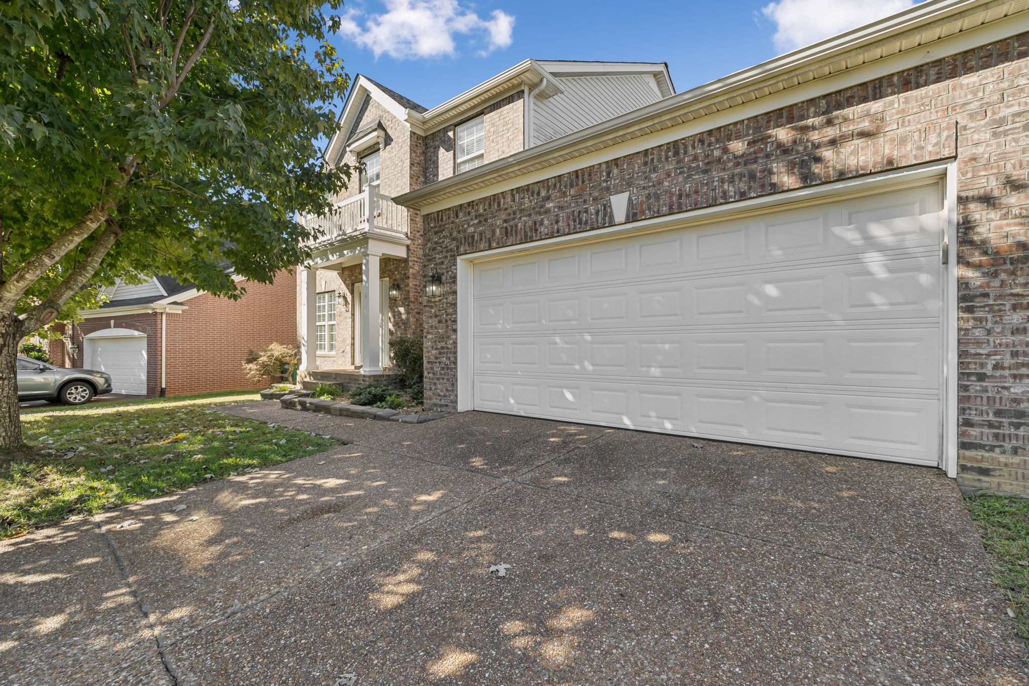 2006 Flocking Drive Spring Hill, TN 37174 - Photo 4 of 86 a front view of a house with a yard and garage