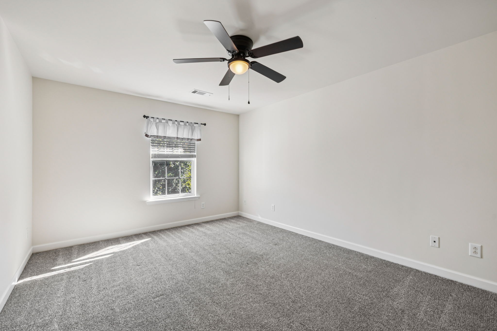 2006 Flocking Drive Spring Hill, TN 37174 - Photo 48 of 86 an empty room with a ceiling fan and window