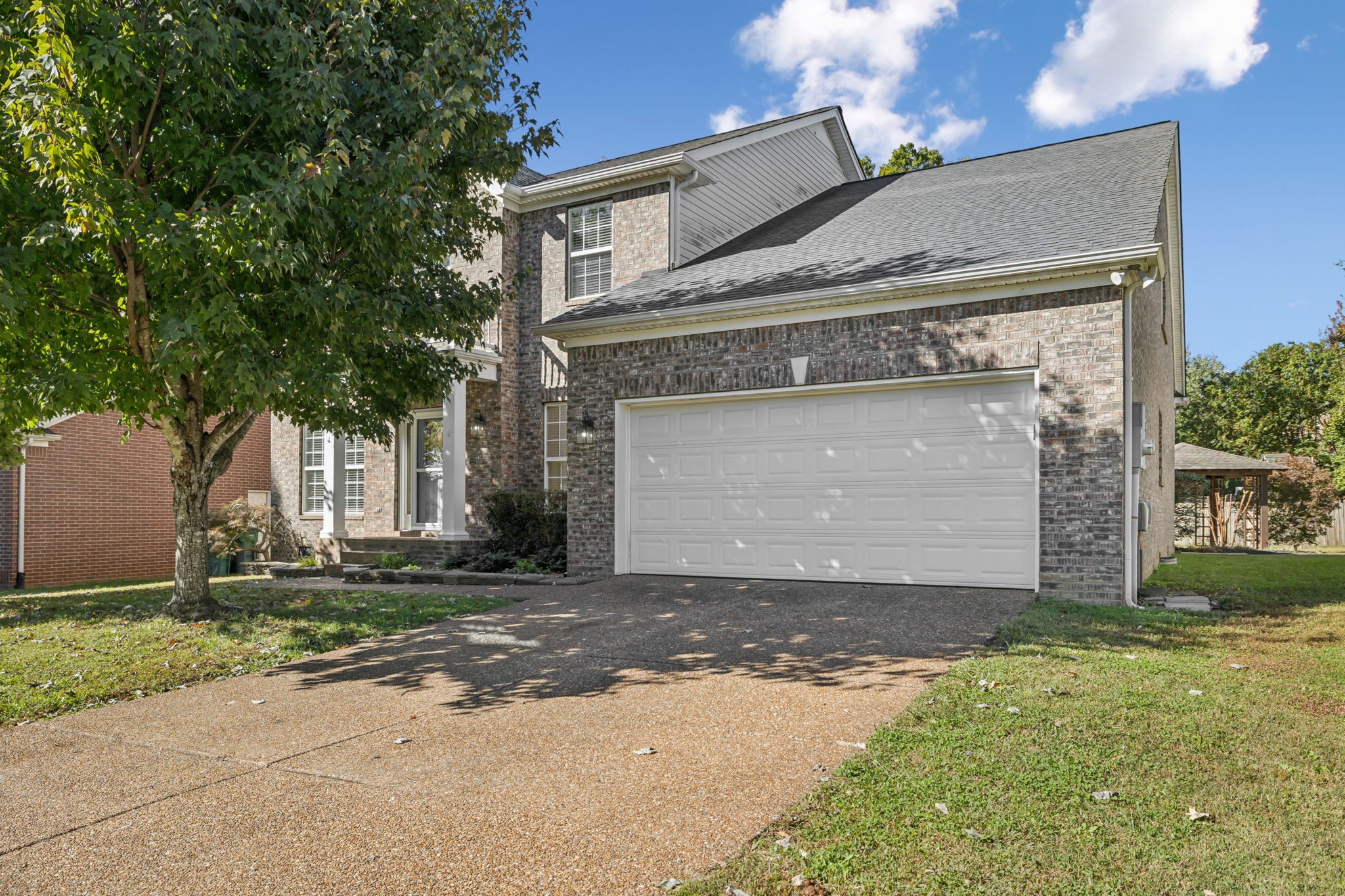 2006 Flocking Drive Spring Hill, TN 37174 - Photo 5 of 86 a front view of a house with a yard and garage