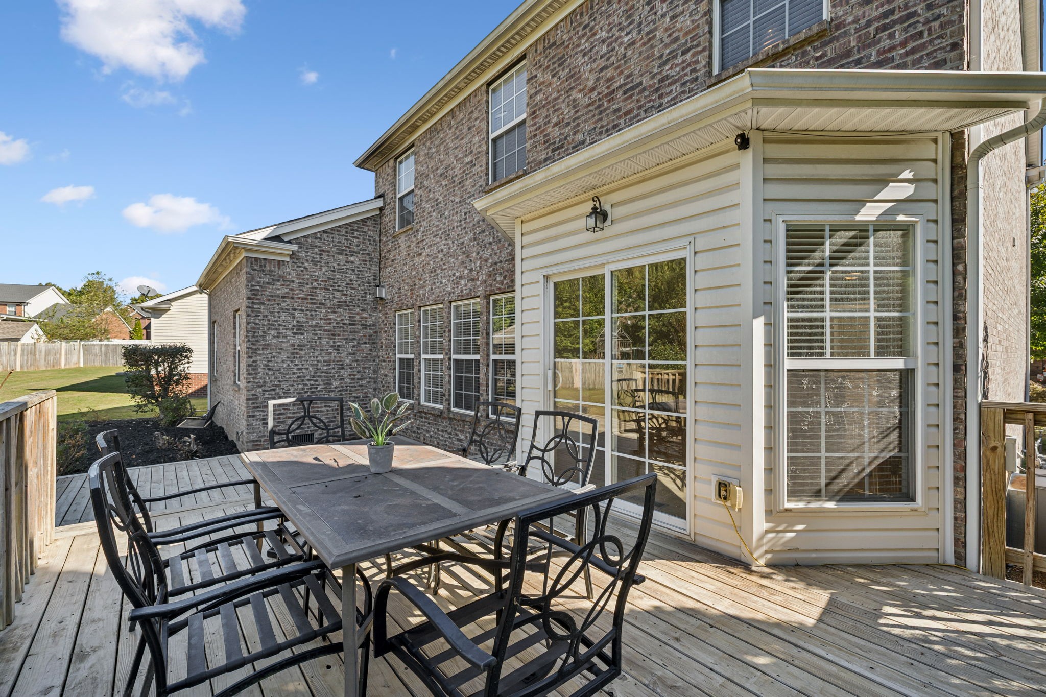 2006 Flocking Drive Spring Hill, TN 37174 - Photo 61 of 86 a view of a patio with table and chairs and wooden floor