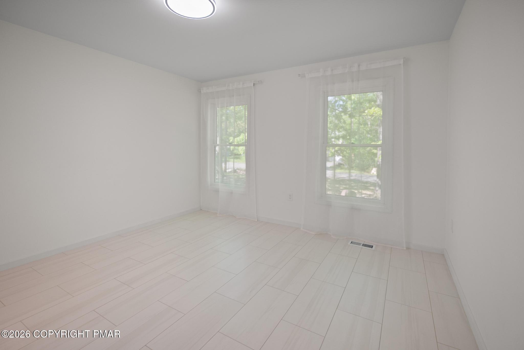 2312 Cramer Court Bushkill, PA 18324 - Photo 20 of 37 an empty room with windows