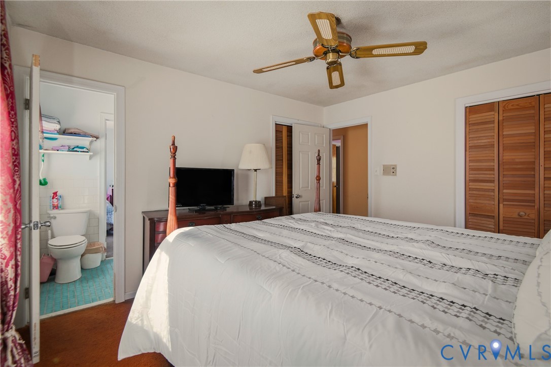 3124 West Hundred Road Chester, VA 23831 - Photo 14 of 28 a bedroom with a bed and a chandelier