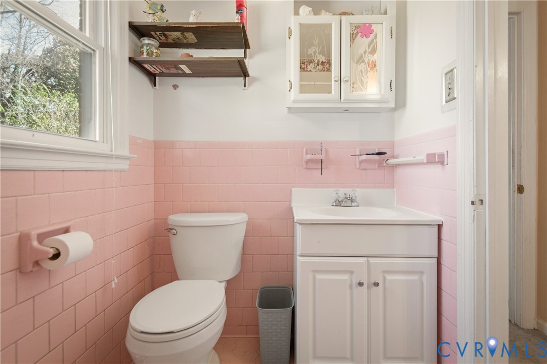 3124 West Hundred Road Chester, VA 23831 - Photo 17 of 28 a bathroom with a sink a toilet and a mirror