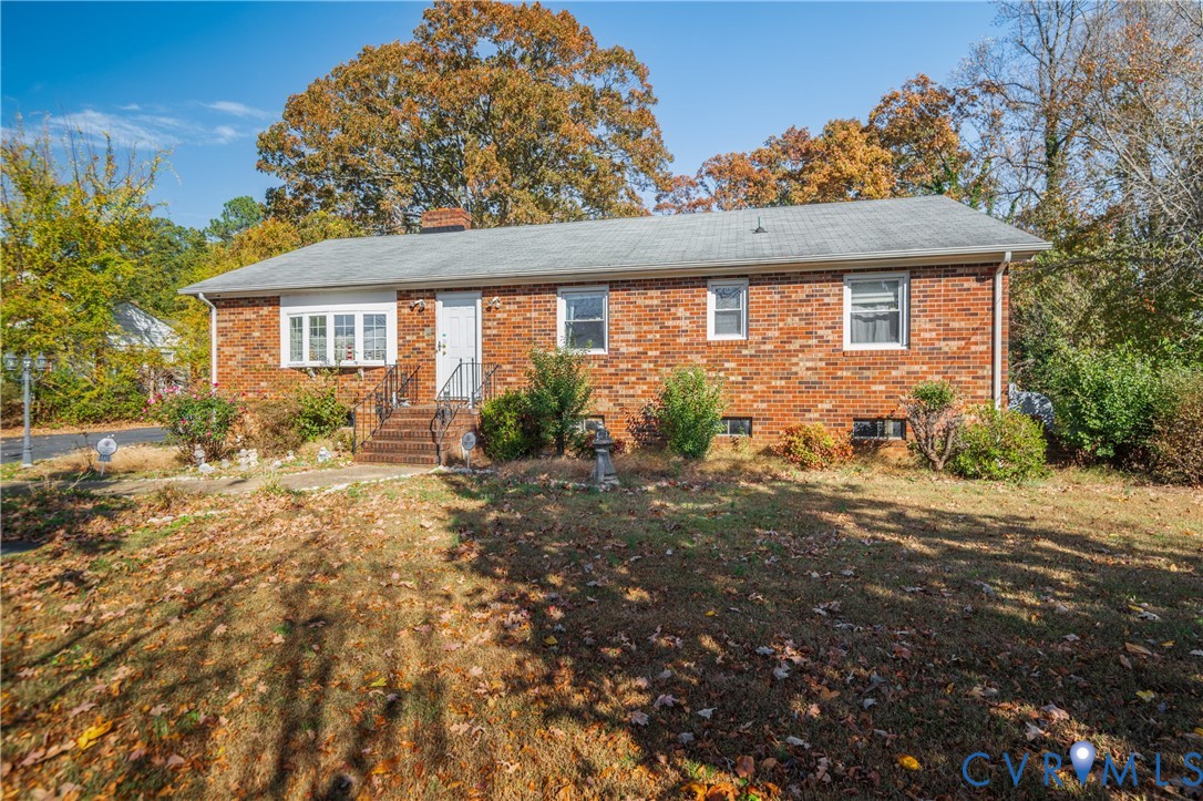 3124 West Hundred Road Chester, VA 23831 - Photo 2 of 28 a front view of a house with garden