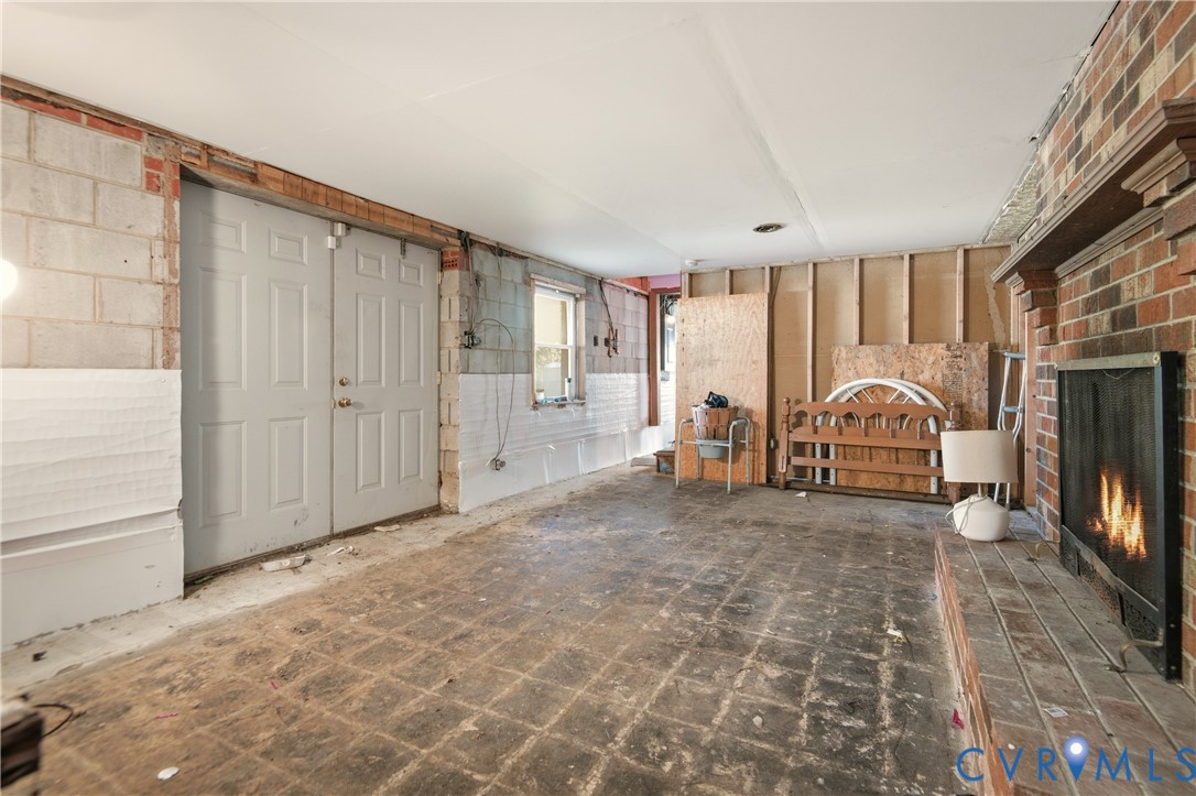 3124 West Hundred Road Chester, VA 23831 - Photo 23 of 28 a view of a livingroom with wooden floor and a fireplace