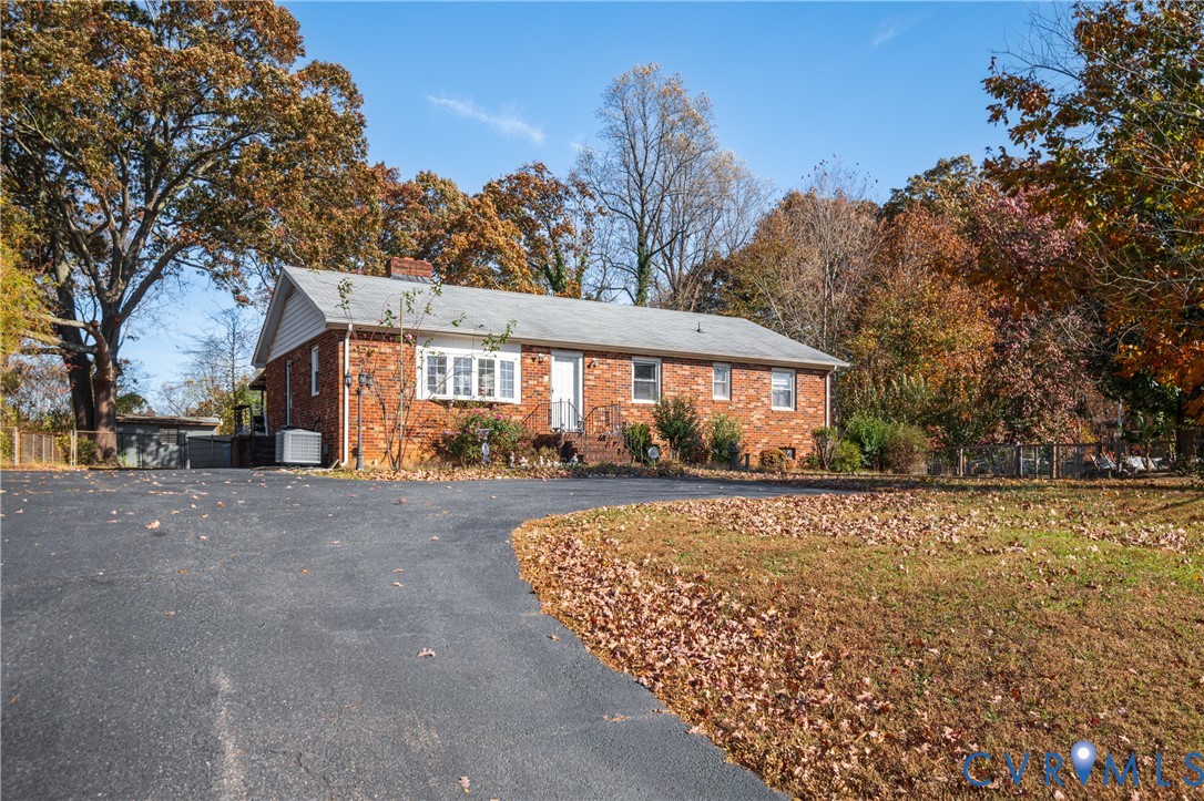 3124 West Hundred Road Chester, VA 23831 - Photo 4 of 28 a view of a house with a yard covered with snow in front of house