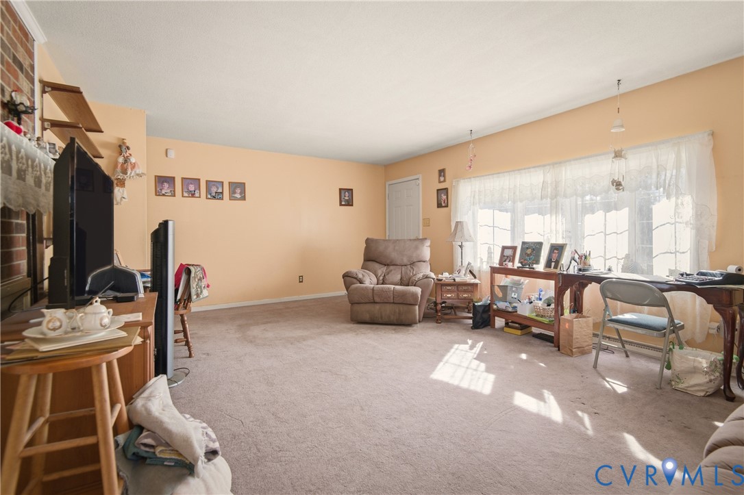 3124 West Hundred Road Chester, VA 23831 - Photo 5 of 28 a living room with furniture and a flat screen tv