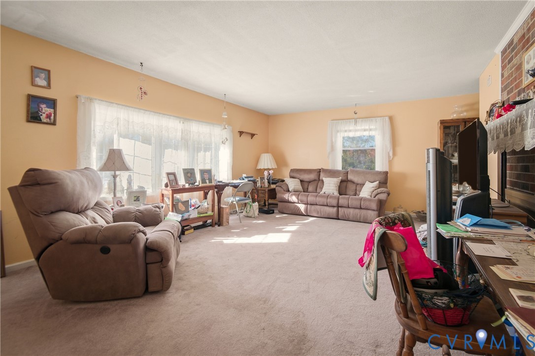 3124 West Hundred Road Chester, VA 23831 - Photo 6 of 28 a living room with furniture and a flat screen tv