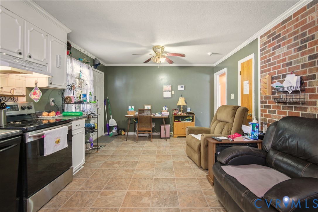 3124 West Hundred Road Chester, VA 23831 - Photo 8 of 28 a living room with furniture flowerpot and a chandelier