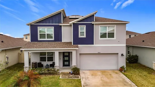 a kitchen with stainless steel appliances a refrigerator and cabinets