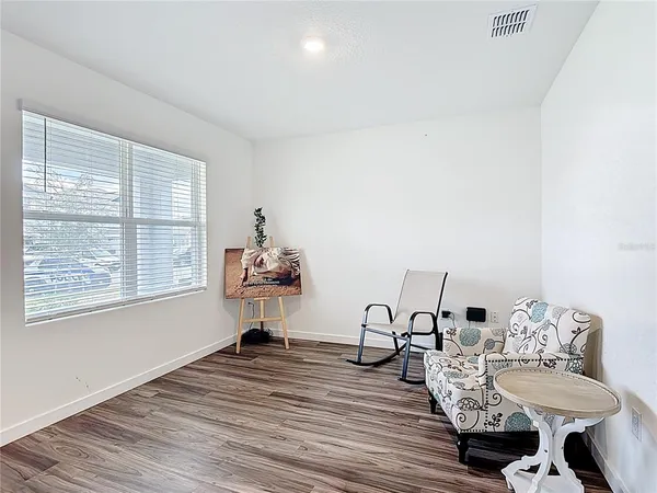 a living room with furniture and a window